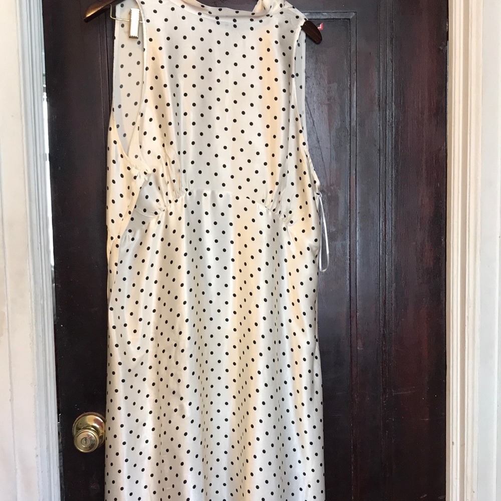 New with tags, cream with black Polk-a-dots sleeveless dress.